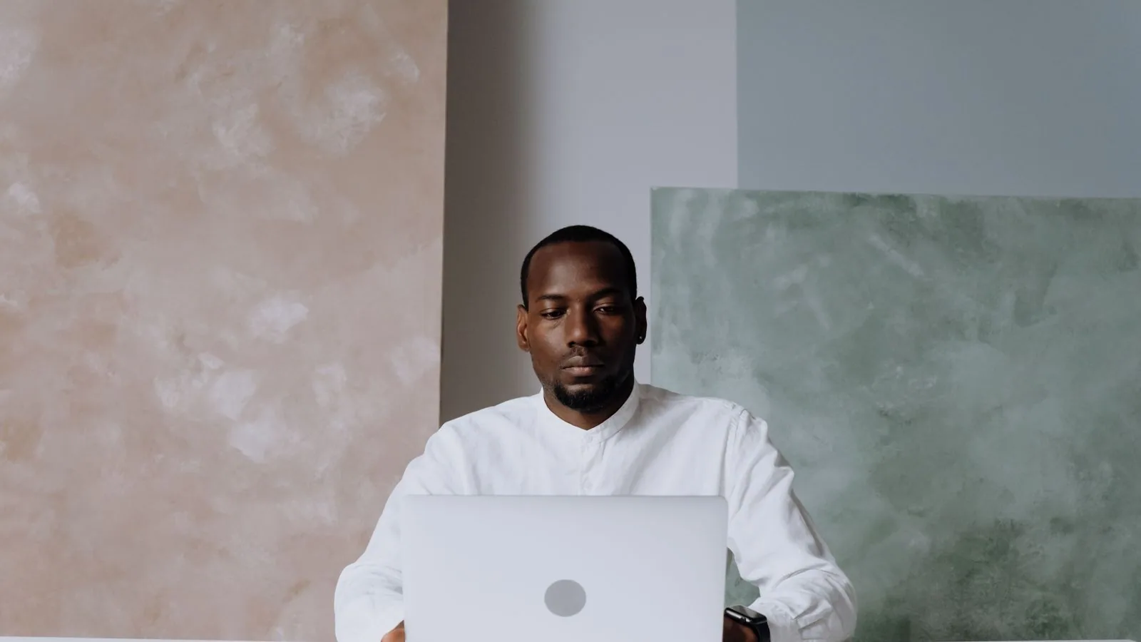 A man working on a laptop at a table