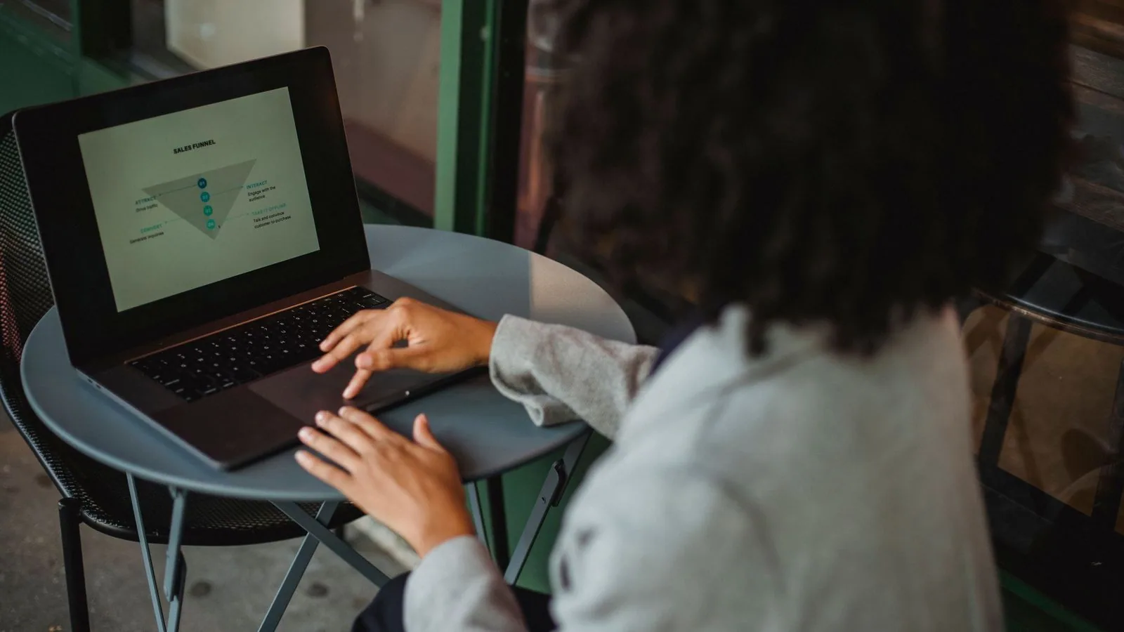 A person checking a chart on a laptop