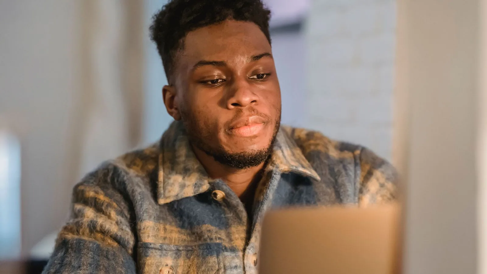 A man working on a laptop indoors