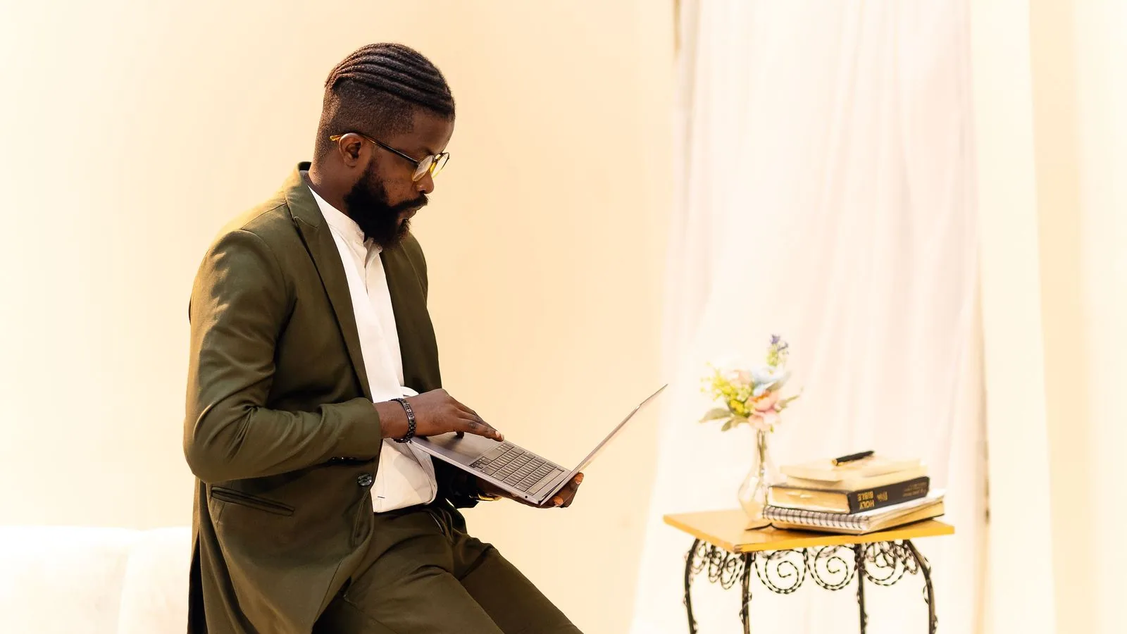 A businessperson using a laptop while seated