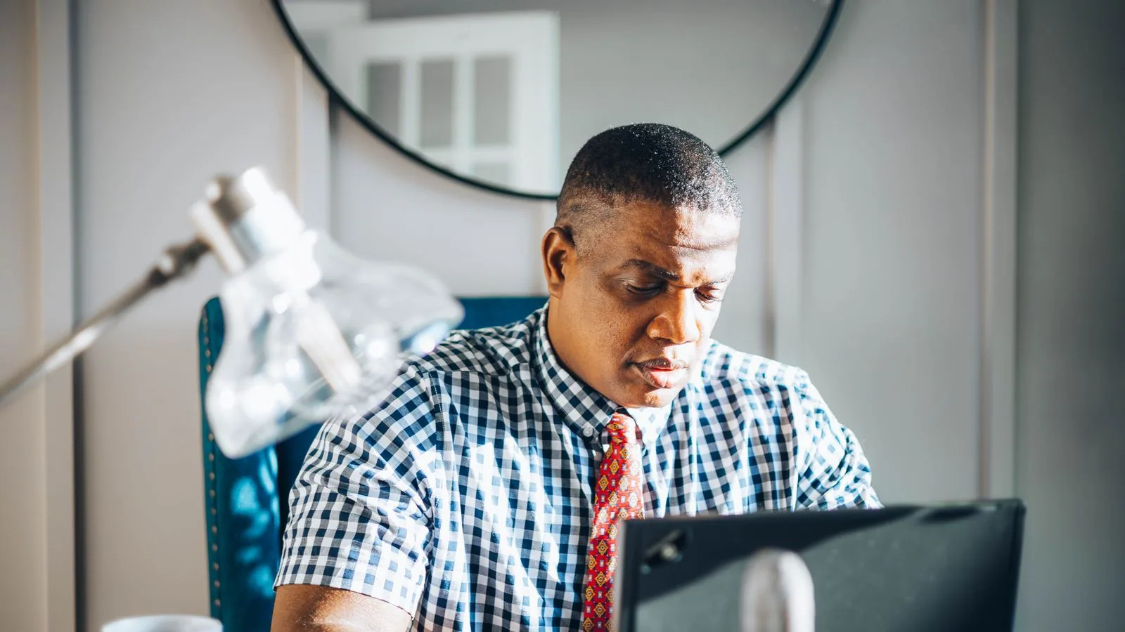 A man working on a laptop at a desk