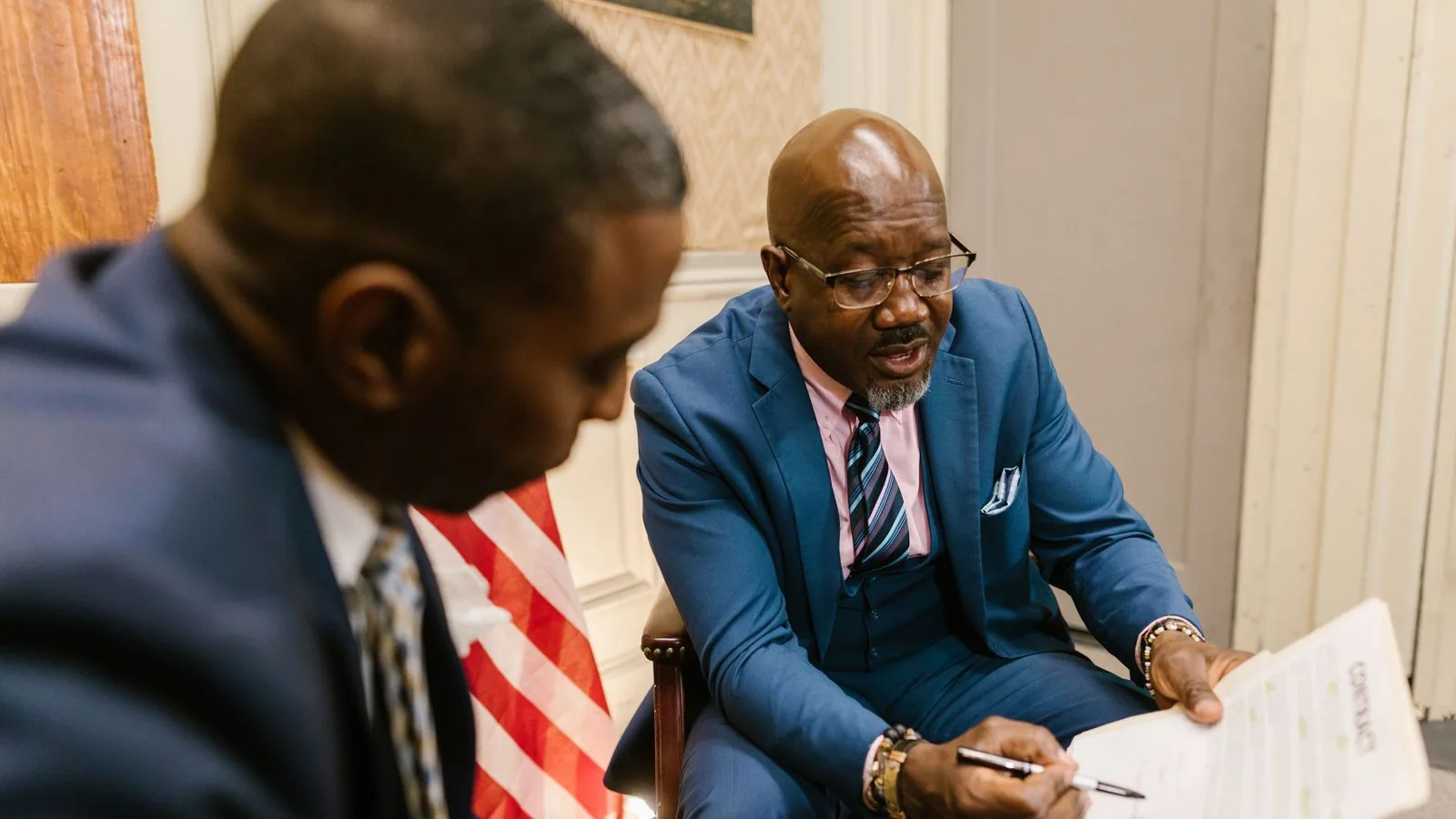 Two businesspeople reviewing a document together